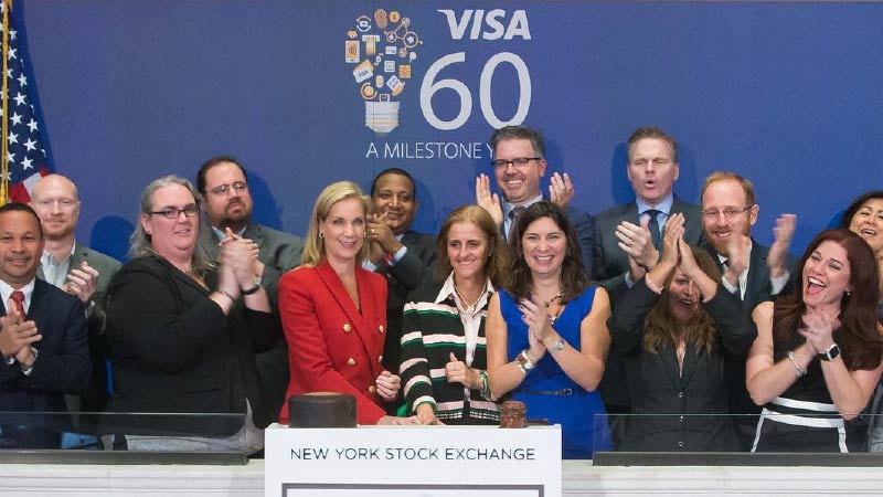 Visa’s Lynne Biggar, Kelly Tullier, & a group of 10+ year employees joined by NYSE President Stacey Cunning to celebrate Visa’s 60 years of existence.